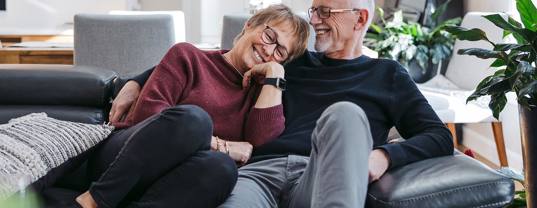 older couple sitting together on the couch